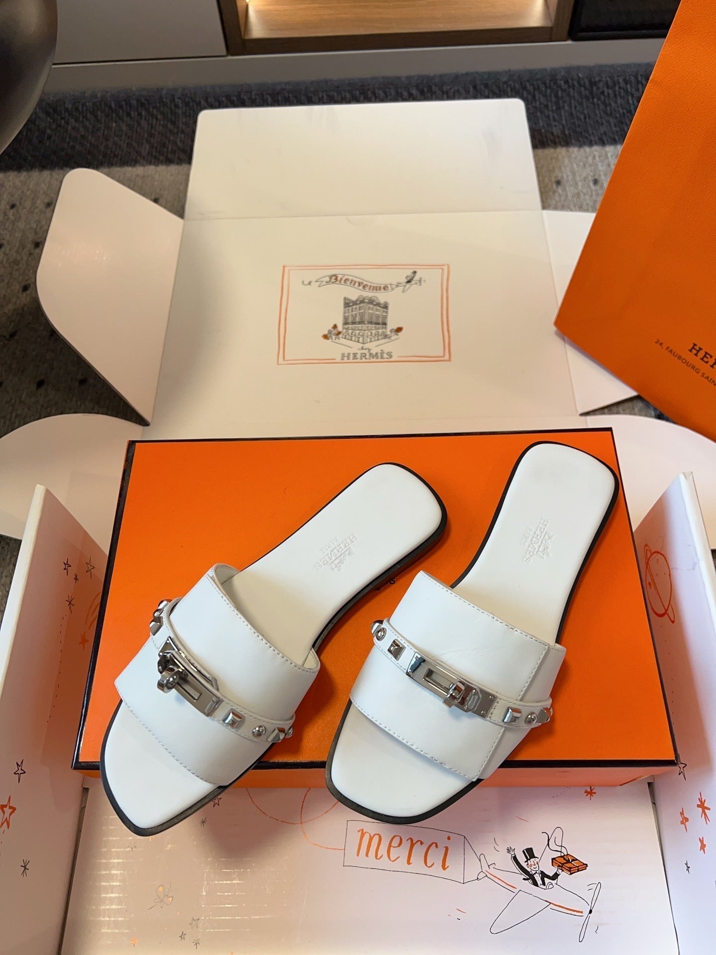 HERMES GIULIA FLAT SANDAL IN WHITE CALFSKIN