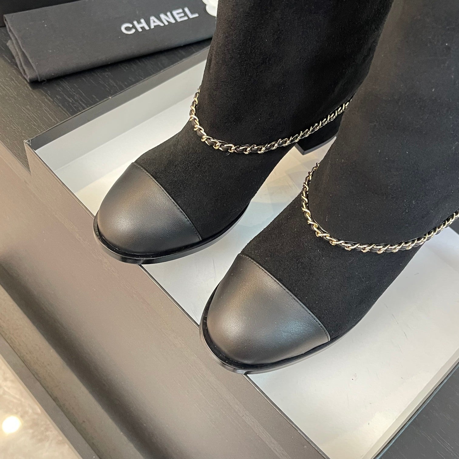CHANEL SHORT BOOTS 6.5 CM IN BLACK SUEDE AND CALFSKIN
