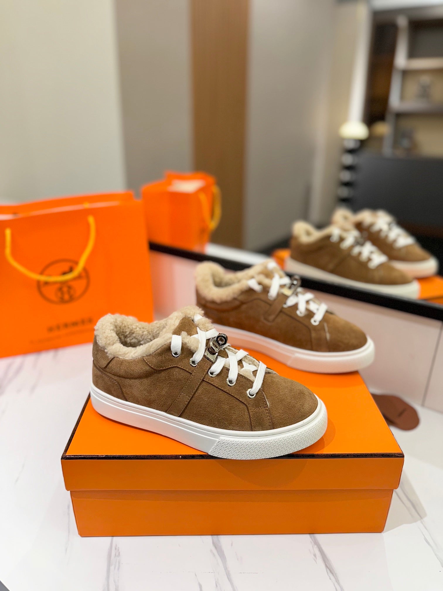 HERMES DAY SNEAKER IN BRONZE BROWN SUEDE AND FLEECE LINING