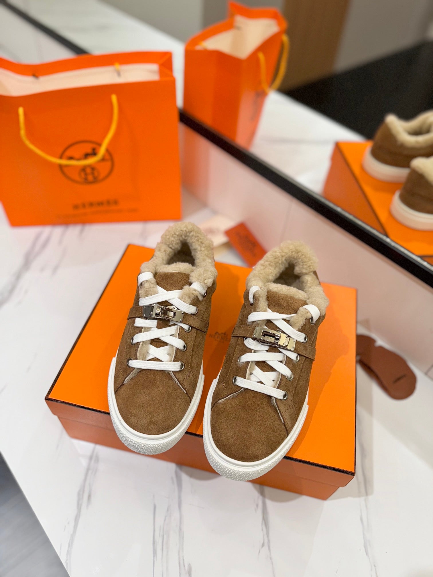 HERMES DAY SNEAKER IN BRONZE BROWN SUEDE AND FLEECE LINING